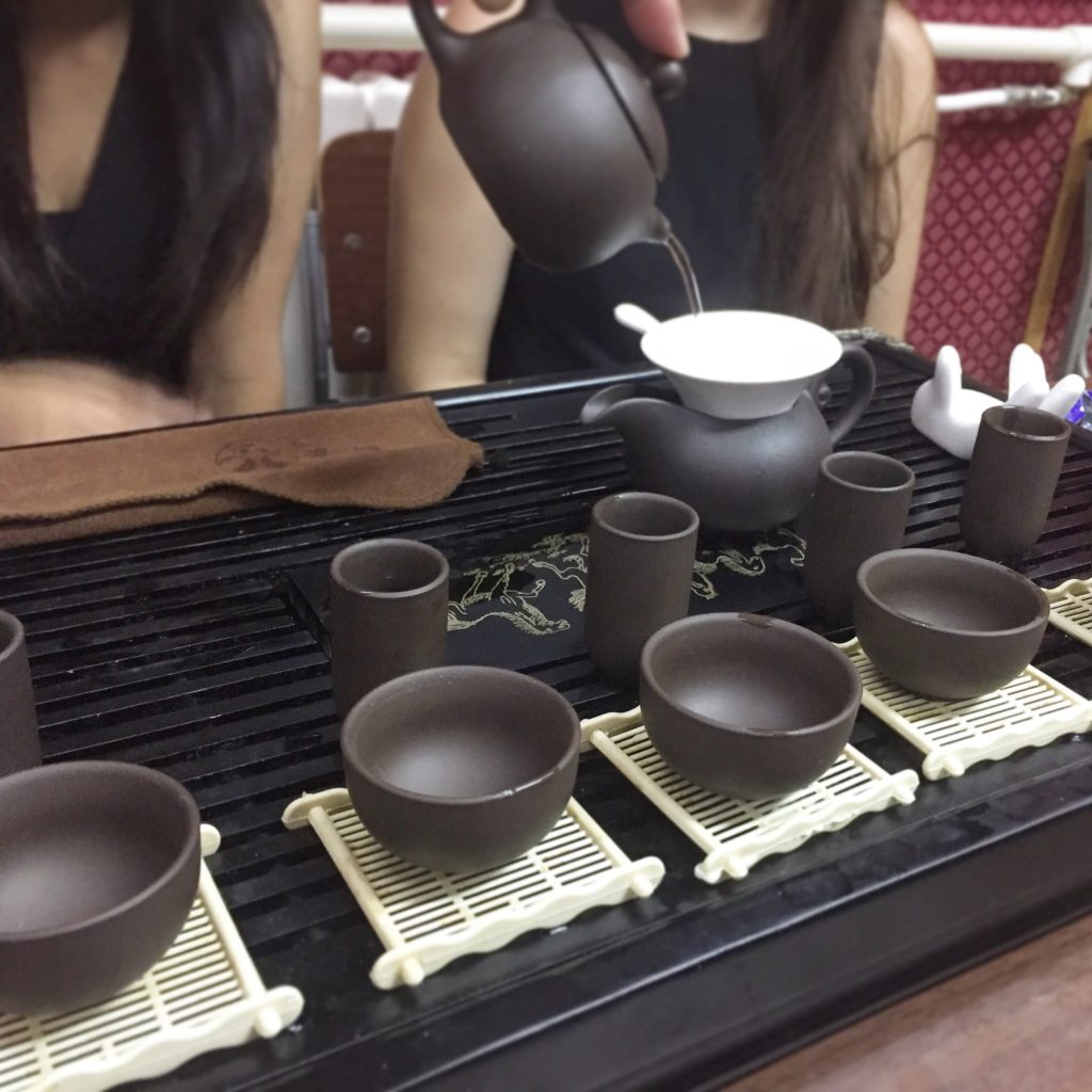 Camp counsellors enjoying a traditional tea ceremony in Beijing